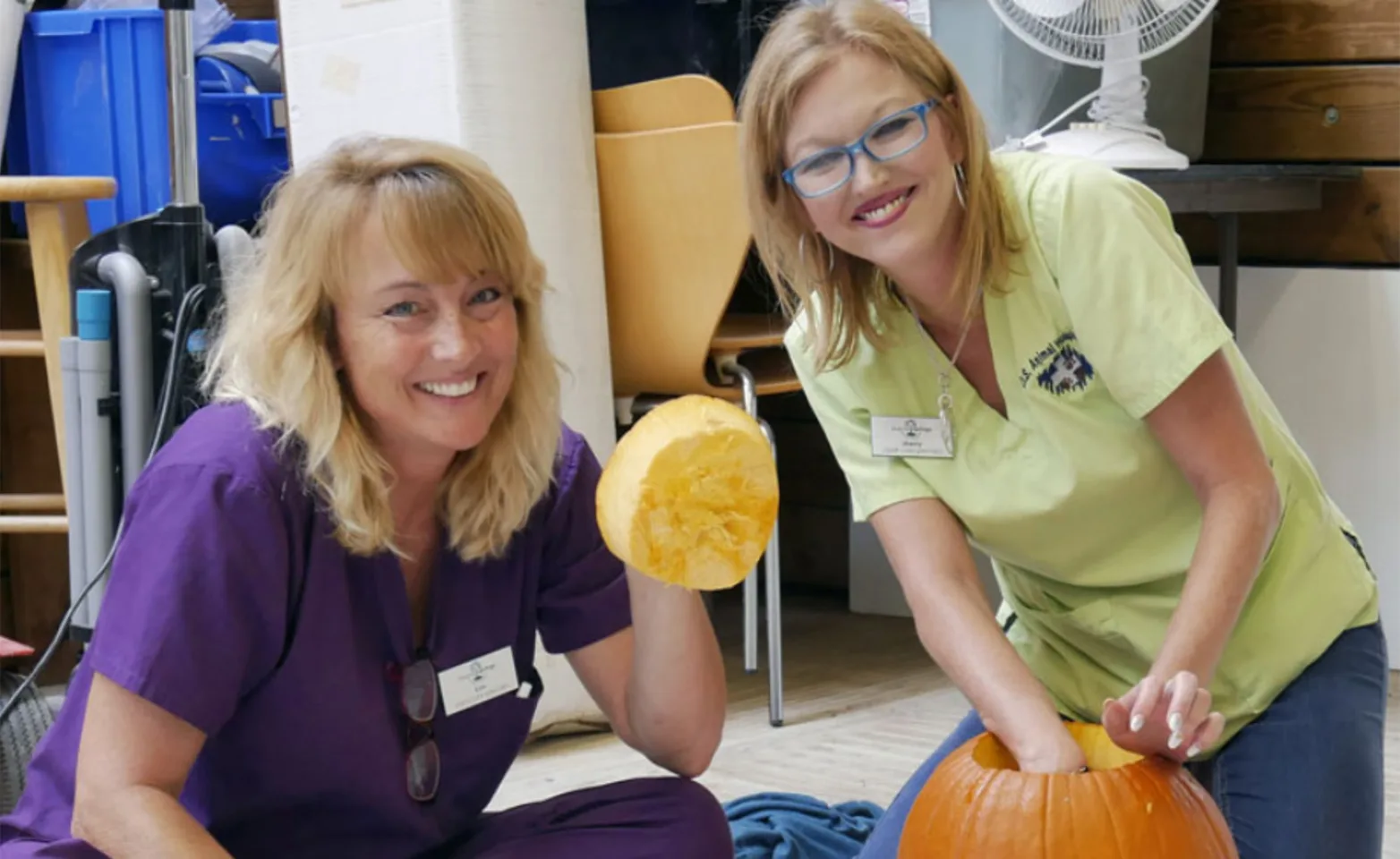 Staff Members Carving a Pumpkin